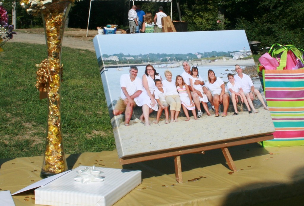 picture of a canvas of a famliy on an easel on a table