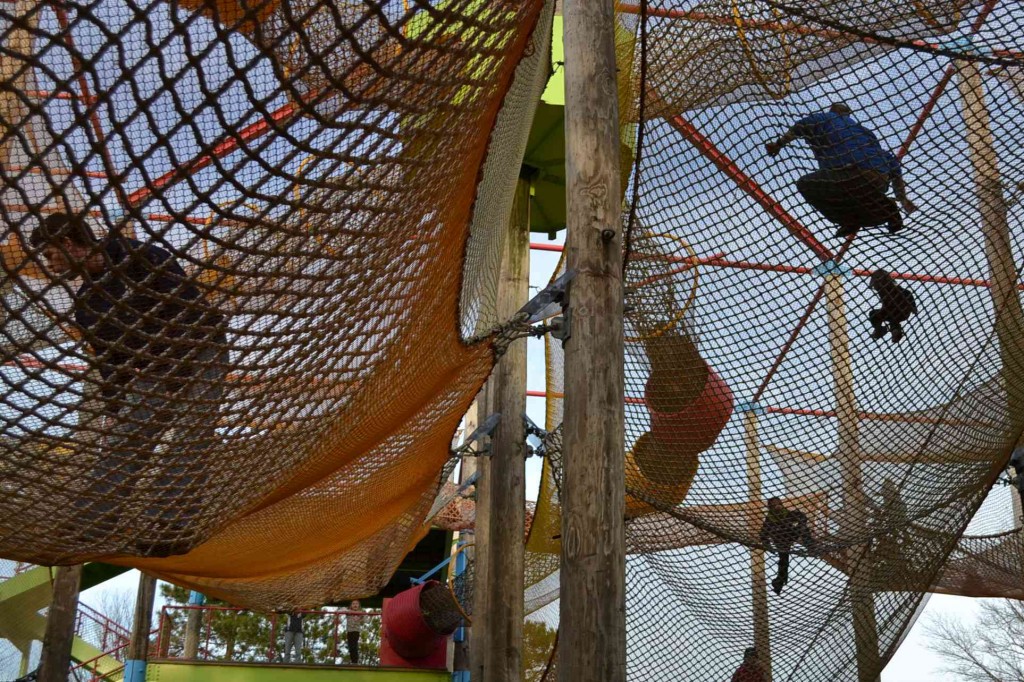 kids in a climbing net