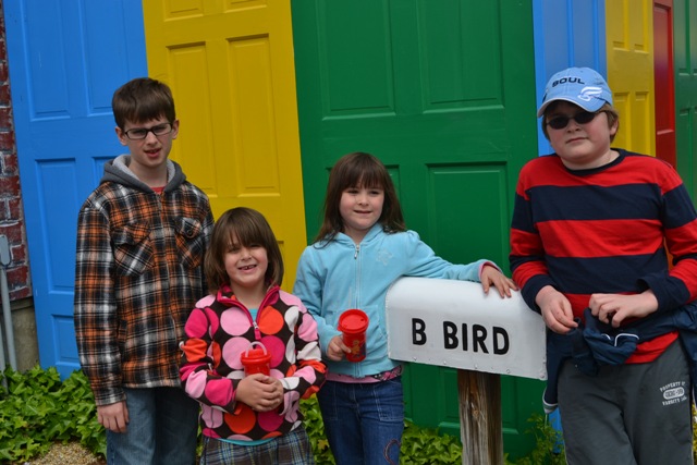 kids near big birds house