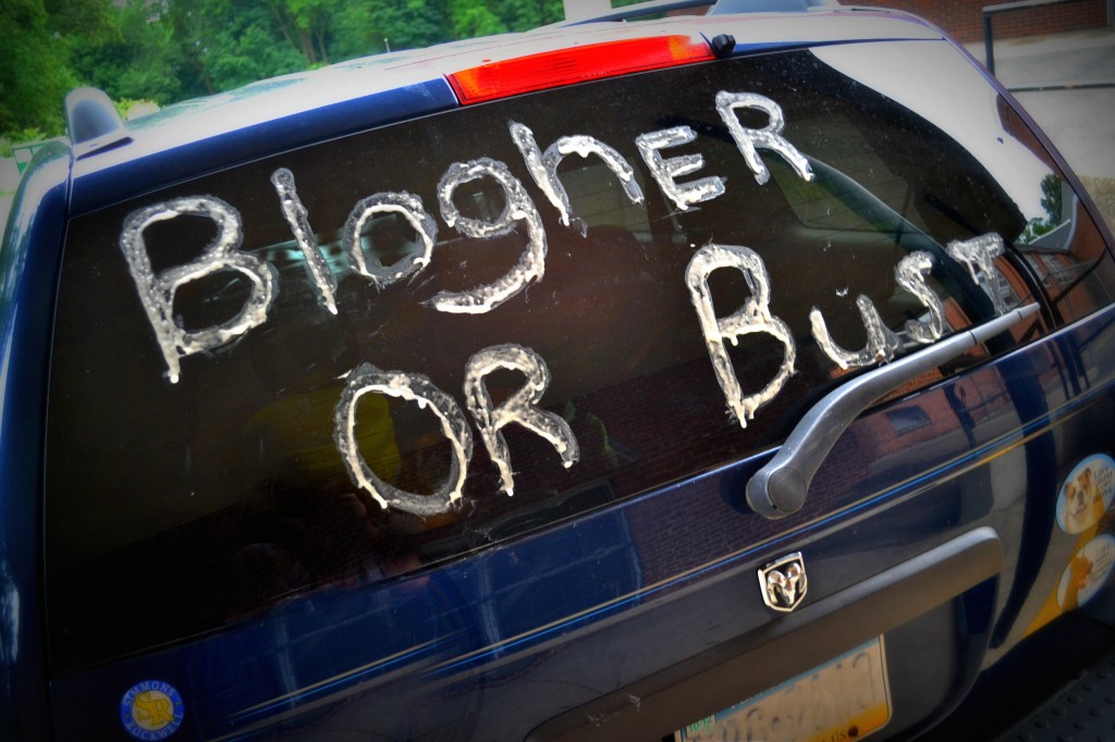 a car with blogher or bust written on back window