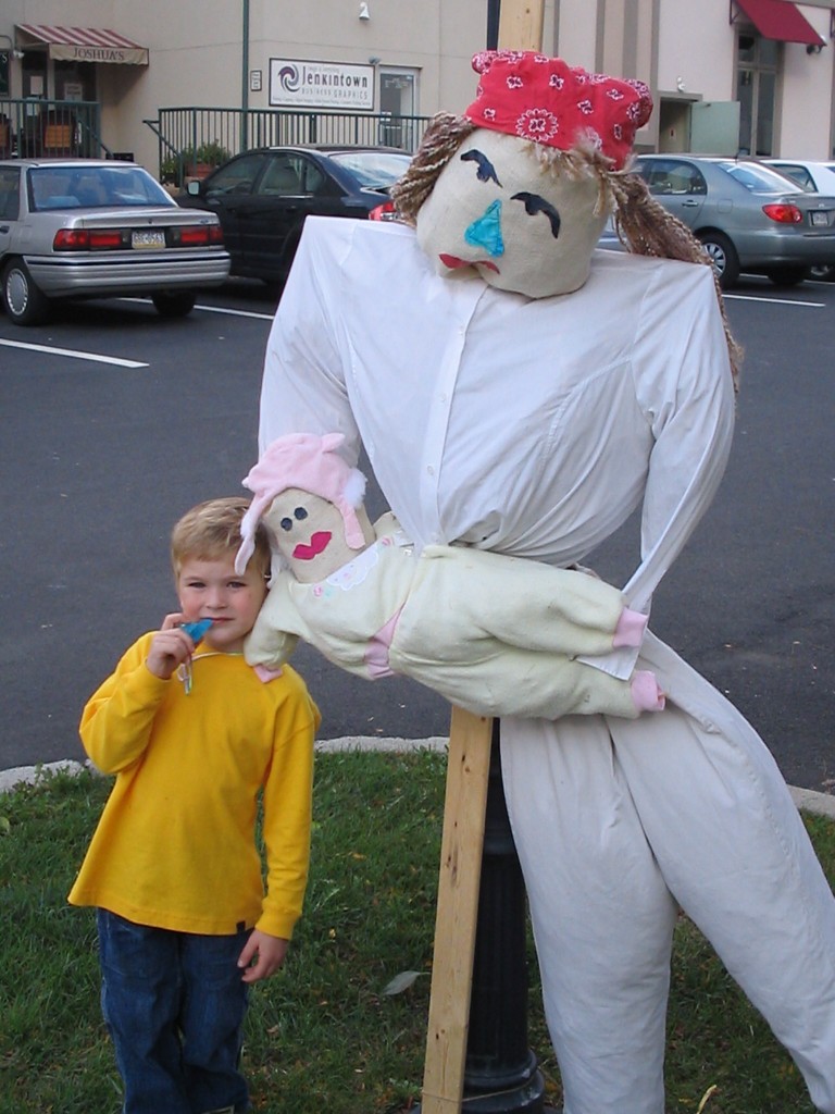 boy with a scarecrow